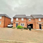 Modern brick houses on a cloudy day