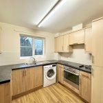 Modern kitchen with wooden cabinets and appliances