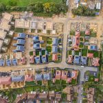 Aerial view of suburban housing development site.