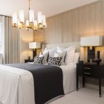 Modern bedroom with elegant lighting and decor.