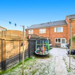 Back garden with trampoline and laundry line