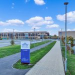 Watling Academy campus with signage and walkways.