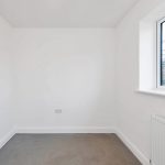 Empty white room with window view