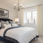 Elegant bedroom with modern decor and large window