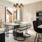 Modern kitchen with dining area and open doors