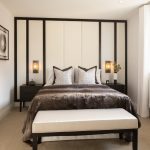 Modern bedroom with stylish decor and natural light.