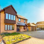 Two-storey suburban house on sunny day
