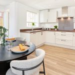 Modern kitchen with dining table and natural light
