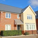 Modern detached house with driveway and garden