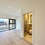 Bright room with large window and en-suite bathroom.