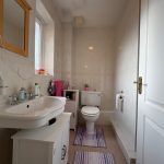 Modern bathroom interior with sink and toilet.