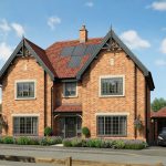 Modern brick house with solar panels.