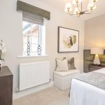 Modern bedroom with window, decor and artwork