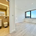 Modern bathroom and room with large window