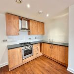Modern kitchen with wooden cabinets and appliances
