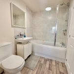 Modern bathroom with bathtub and toilet