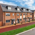 Modern row of new red-brick terraced houses.