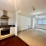 Modern kitchen and living room interior.
