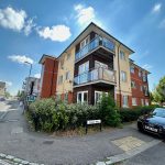 Modern apartment building on Cavan Way, sunny day.