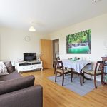 Cosy living room with dining area and decor.