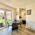 Bright dining area with garden view.