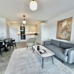 Modern open-plan living room and kitchen interior design.