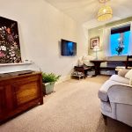 Cosy living room with painting and modern decor.