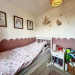 Cosy child's bedroom with toys and animal decor.