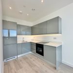 Modern grey kitchen with integrated appliances