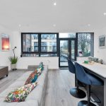 Modern living room with large windows and stylish decor