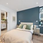 Modern bedroom with ensuite and natural light.