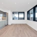 Modern flat with kitchen and city views.