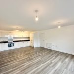 Spacious modern kitchen with wooden flooring