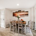 Dining room with wooden table and chairs