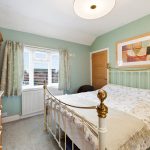 Cosy bedroom with double bed and decor