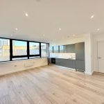Modern, spacious open-plan kitchen and living area.