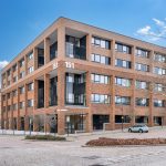 Modern brick office building on a corner street