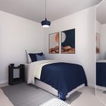 Modern bedroom with blue bedding and wall art