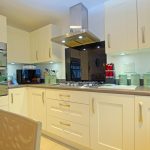 Modern kitchen with appliances and cabinets.