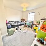 Children's bedroom with toys and decorations.