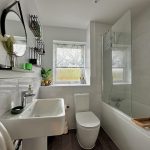Modern bathroom with white sink and bath