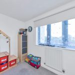 Children's room with toys and storage boxes.