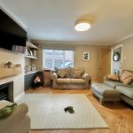 Cosy living room with modern decor and furniture.