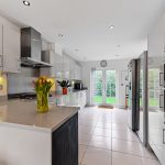 Modern kitchen with sleek design and tulip vase