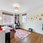 Children's room with space-themed decor and toys.