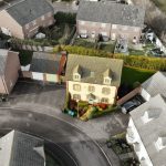 Aerial view of suburban houses with gardens