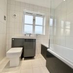 Modern bathroom with bathtub and toilet