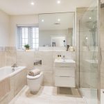 Modern bathroom with shower, bathtub, and sink