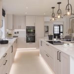 Modern kitchen interior with island and appliances.