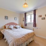 Cosy bedroom with double bed and decor